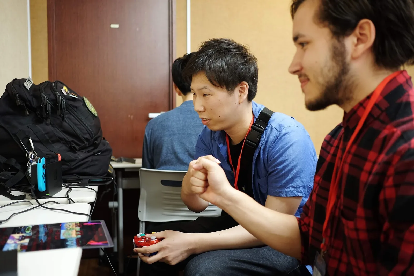 Two players focused on a match at a gaming event in Japan